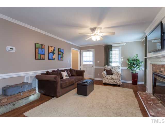 4521 Hershey Court Raleigh, NC 27613 - Photo 5 of 24 a living room with furniture and a fireplace