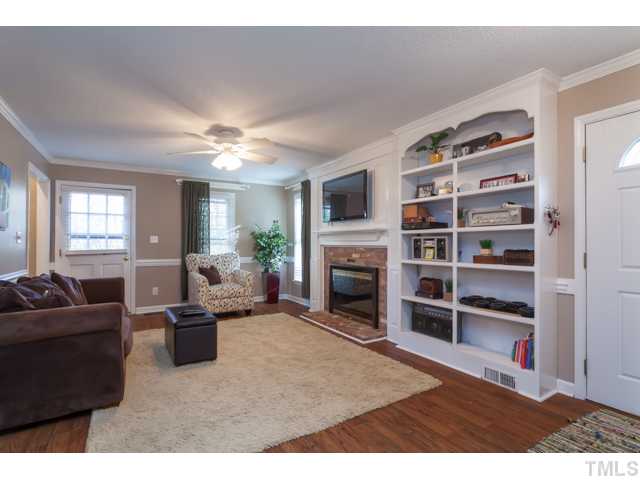 4521 Hershey Court Raleigh, NC 27613 - Photo 6 of 24 a living room with furniture and a fireplace