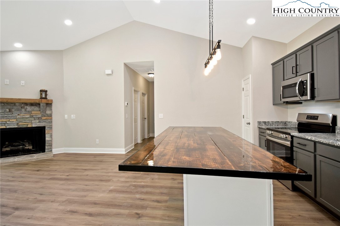 598 Running Deer Trail Boone, NC 28607 - Photo 17 of 49 a kitchen view with a stove and a refrigerator