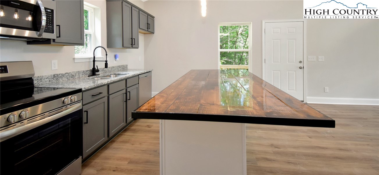 598 Running Deer Trail Boone, NC 28607 - Photo 22 of 49 a view of a kitchen cabinets and a wooden floor