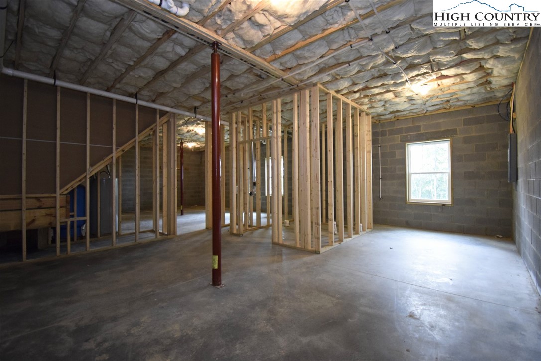 598 Running Deer Trail Boone, NC 28607 - Photo 39 of 49 a view of empty room with floor to ceiling window