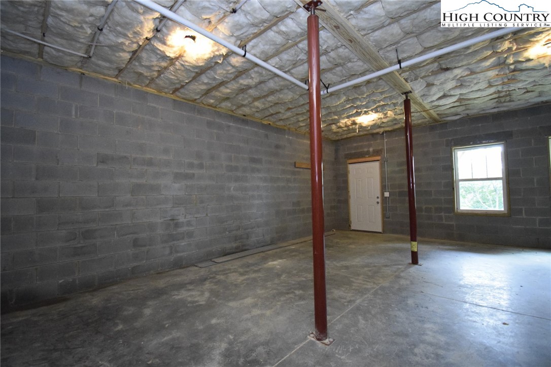 598 Running Deer Trail Boone, NC 28607 - Photo 40 of 49 a view of empty room with wooden floor