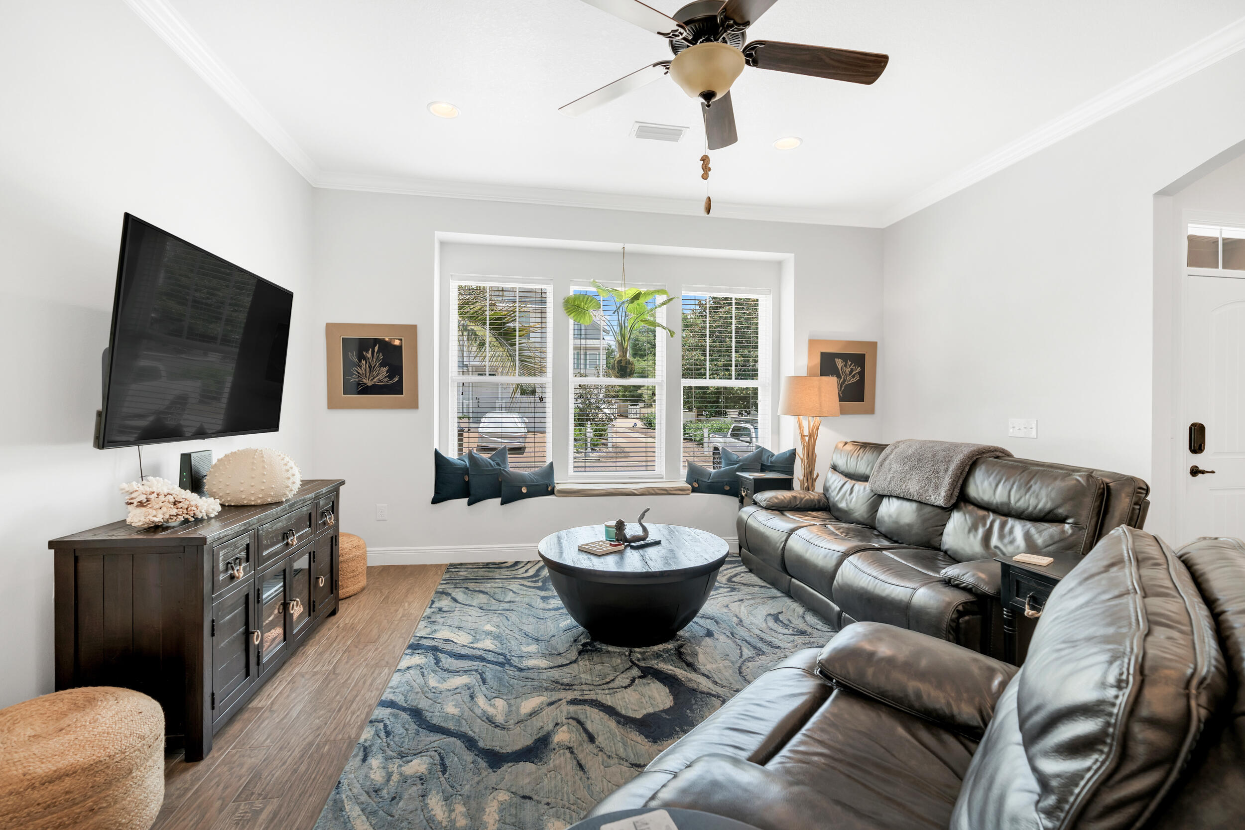 38 Inlet Cove Inlet Beach, FL 32461 - Photo 20 of 51 a living room with furniture a flat screen tv and a large window