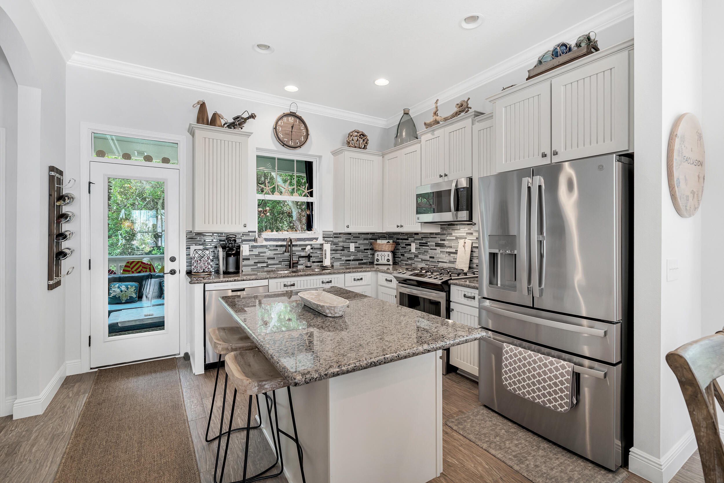 38 Inlet Cove Inlet Beach, FL 32461 - Photo 27 of 51 a kitchen with stainless steel appliances granite countertop a refrigerator a sink and a stove
