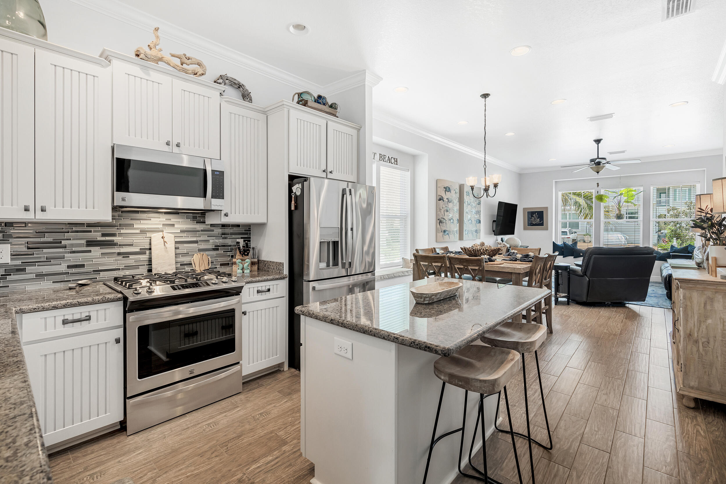 38 Inlet Cove Inlet Beach, FL 32461 - Photo 28 of 51 a kitchen with stainless steel appliances a stove a sink a refrigerator and a center island