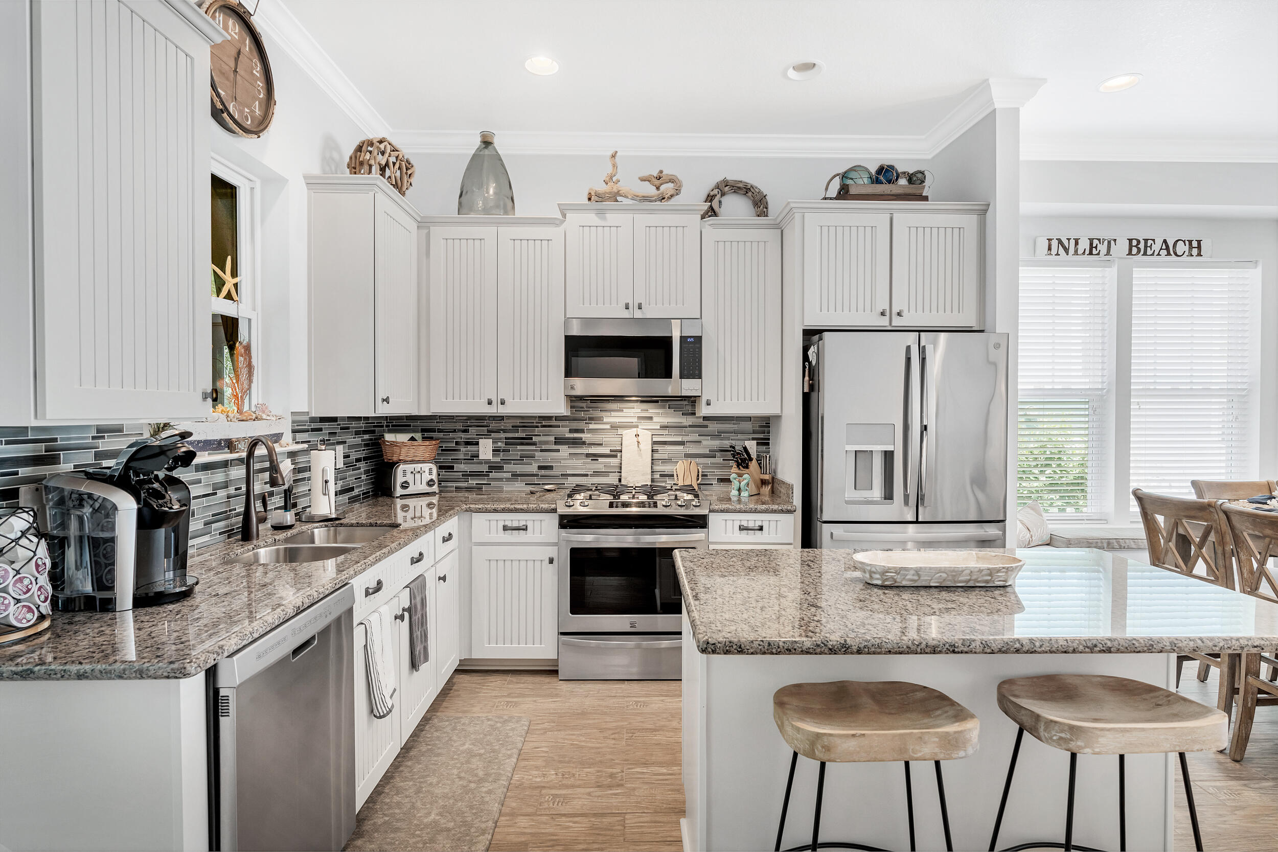 38 Inlet Cove Inlet Beach, FL 32461 - Photo 29 of 51 a kitchen with stainless steel appliances granite countertop a stove a sink and a refrigerator