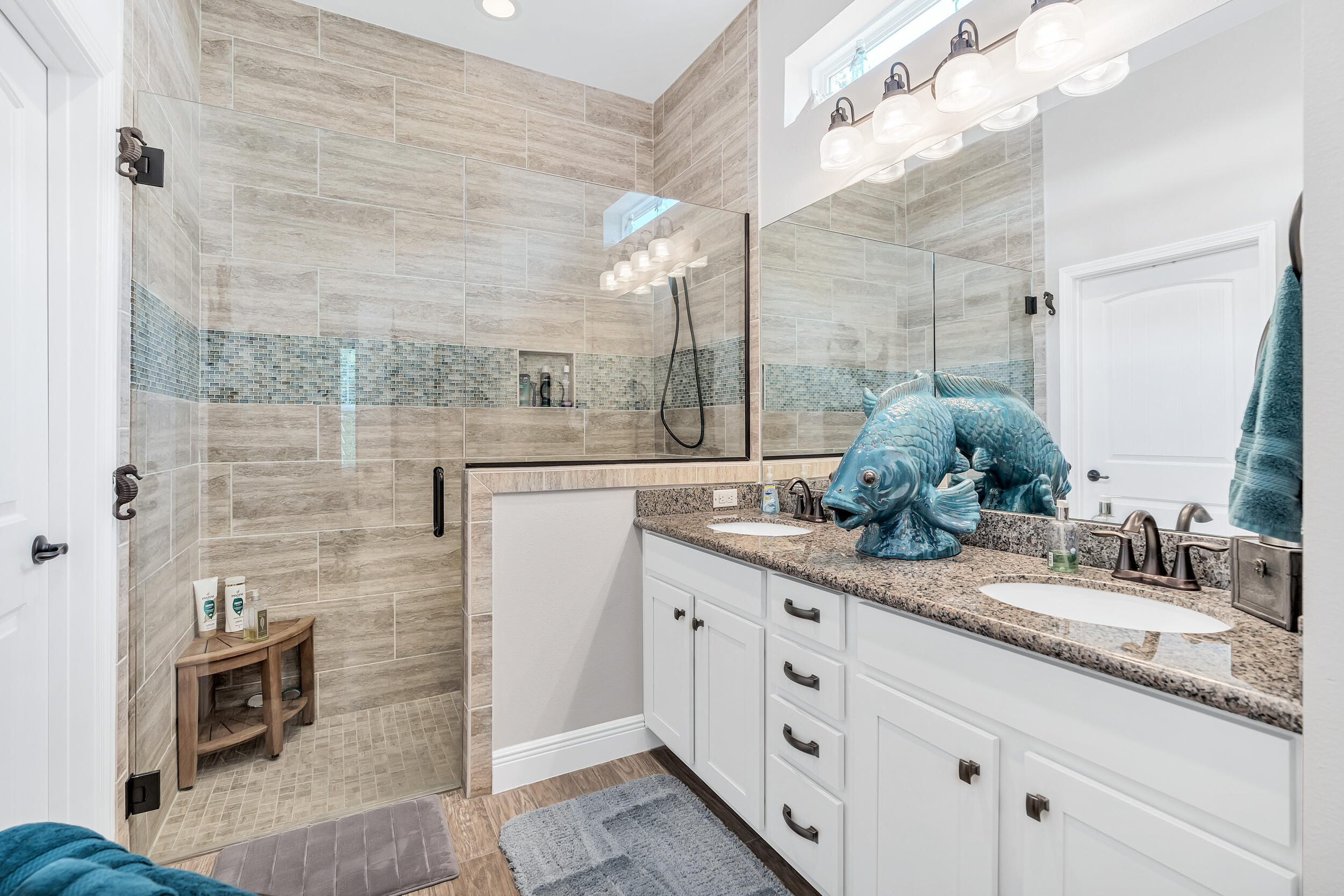 38 Inlet Cove Inlet Beach, FL 32461 - Photo 34 of 51 a bathroom with a granite countertop sink a mirror and shower
