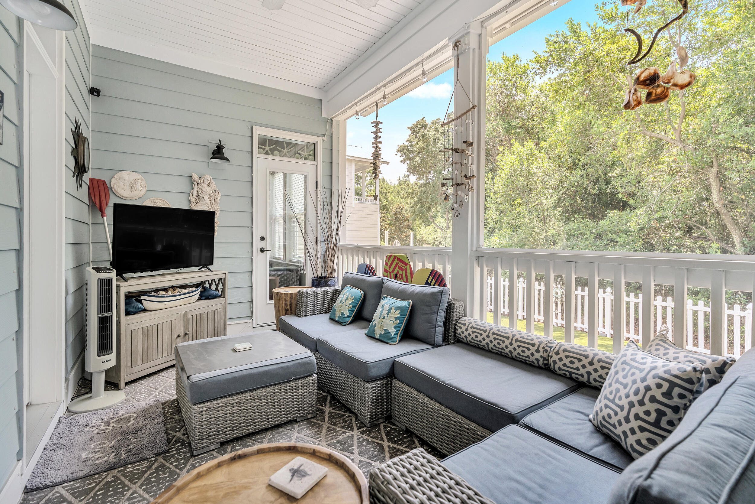 38 Inlet Cove Inlet Beach, FL 32461 - Photo 36 of 51 a living room with furniture a flat screen tv and a floor to ceiling window