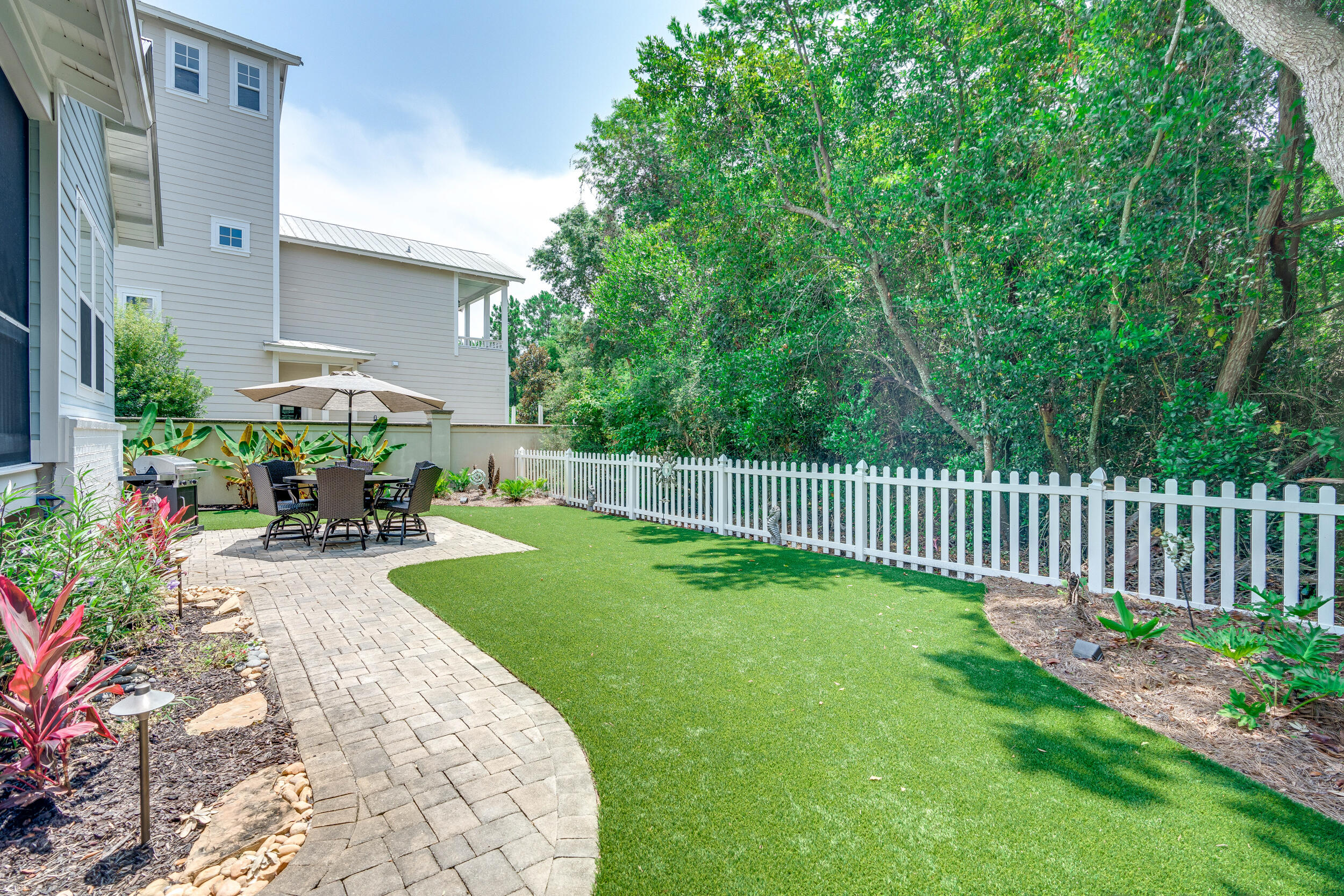 38 Inlet Cove Inlet Beach, FL 32461 - Photo 6 of 51 a view of a chair and table in the garden
