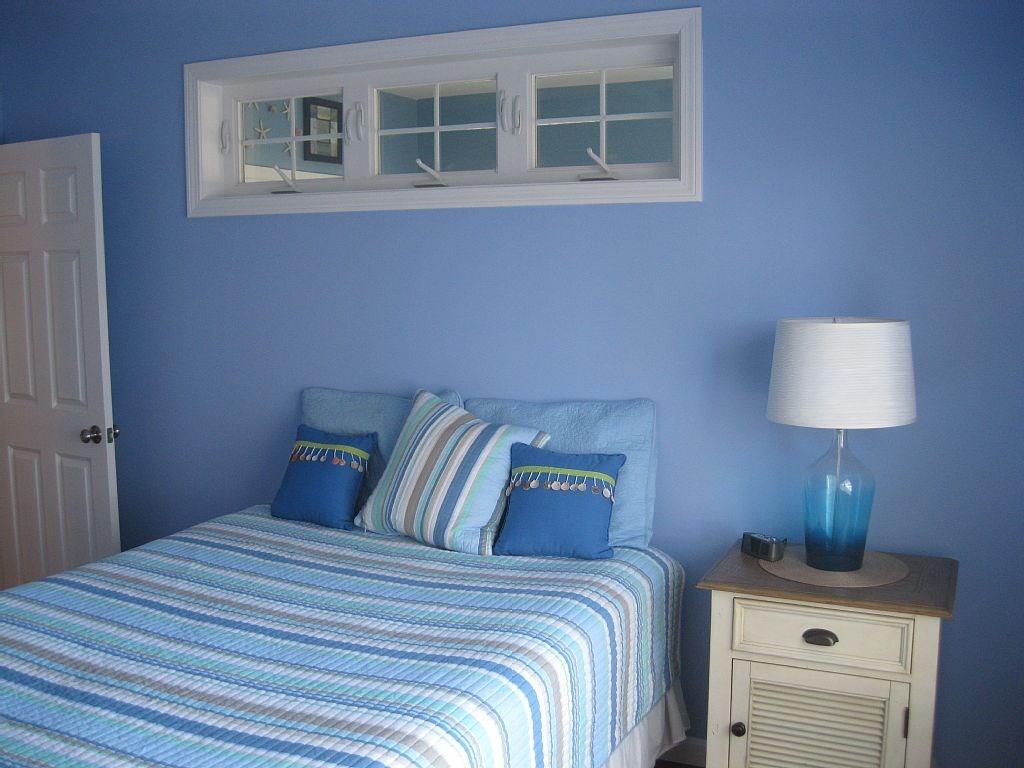 35 Barefoot Cottage Road, Unit 139 Wells, ME 04090 - Photo 7 of 17 Master bedroom in cool ocean blue.