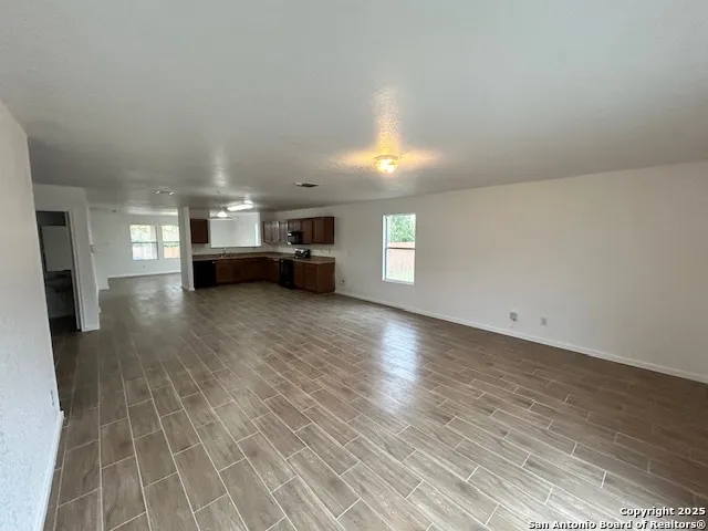 a view of living room with furniture and window
