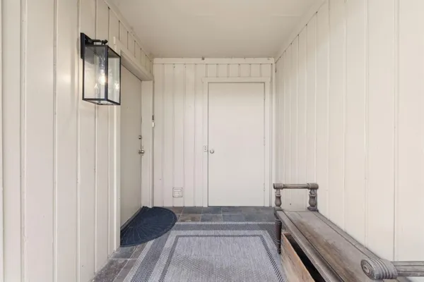 a view of a hallway with washer and dryer