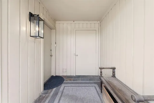 a view of a hallway with washer and dryer