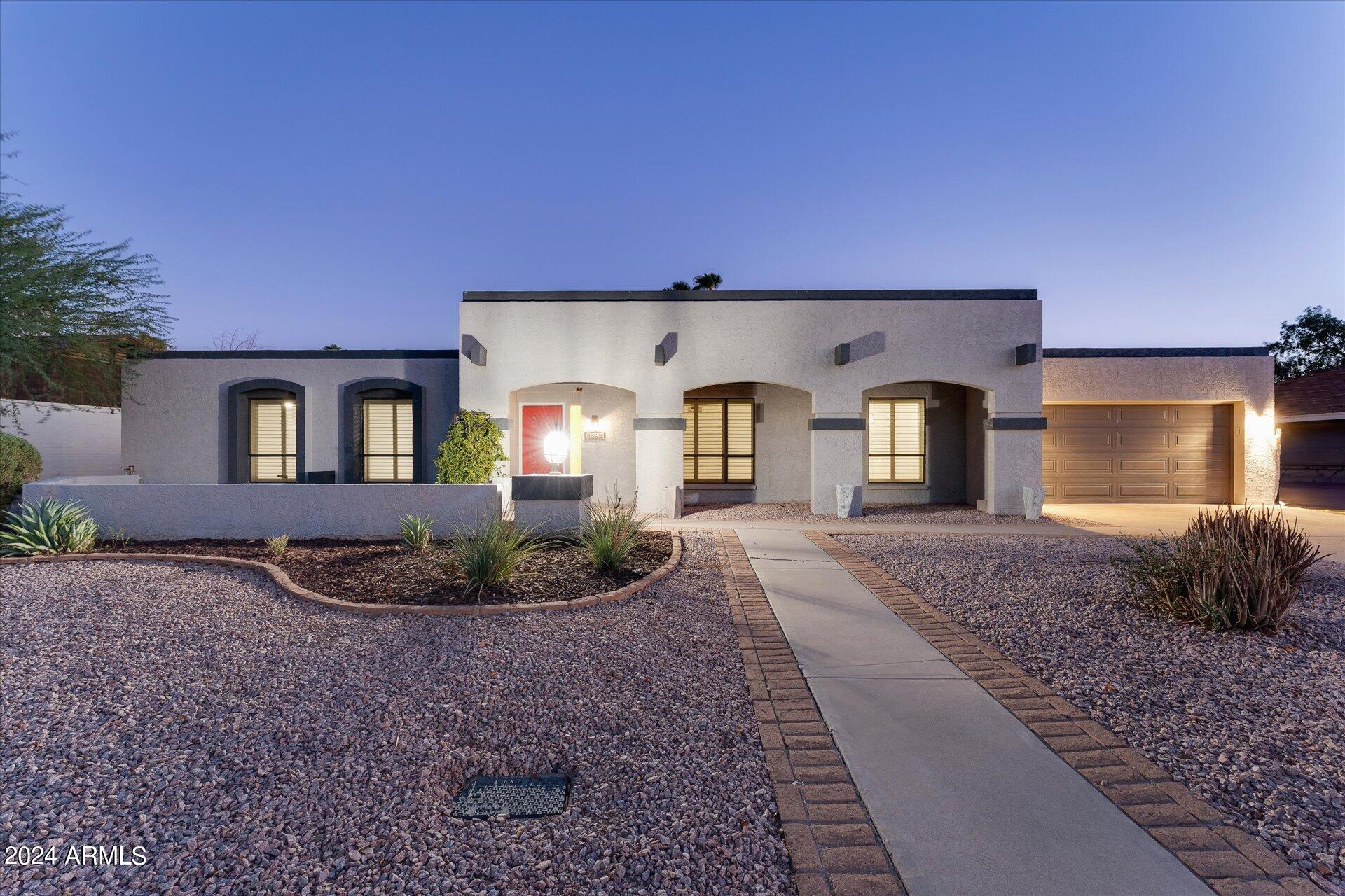 1893 East Bendix Drive Tempe, AZ 85283 - Photo 1 of 45 a front view of a house with garden