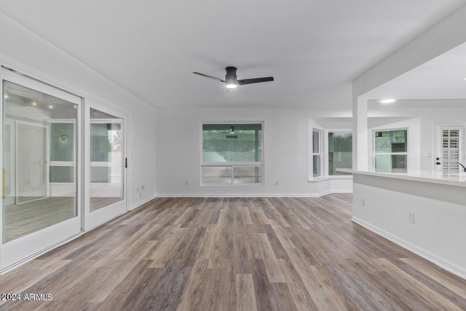 1893 East Bendix Drive Tempe, AZ 85283 - Photo 15 of 45 wooden floor in an empty room with a window