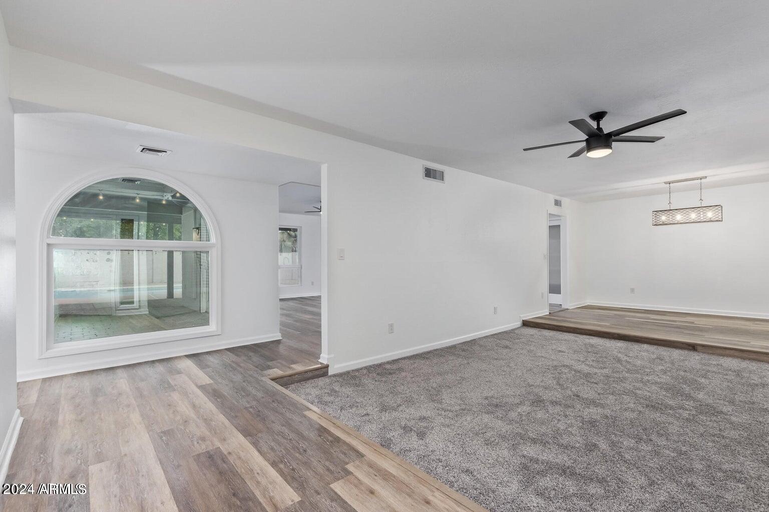 1893 East Bendix Drive Tempe, AZ 85283 - Photo 16 of 45 wooden floor in an empty room with a window