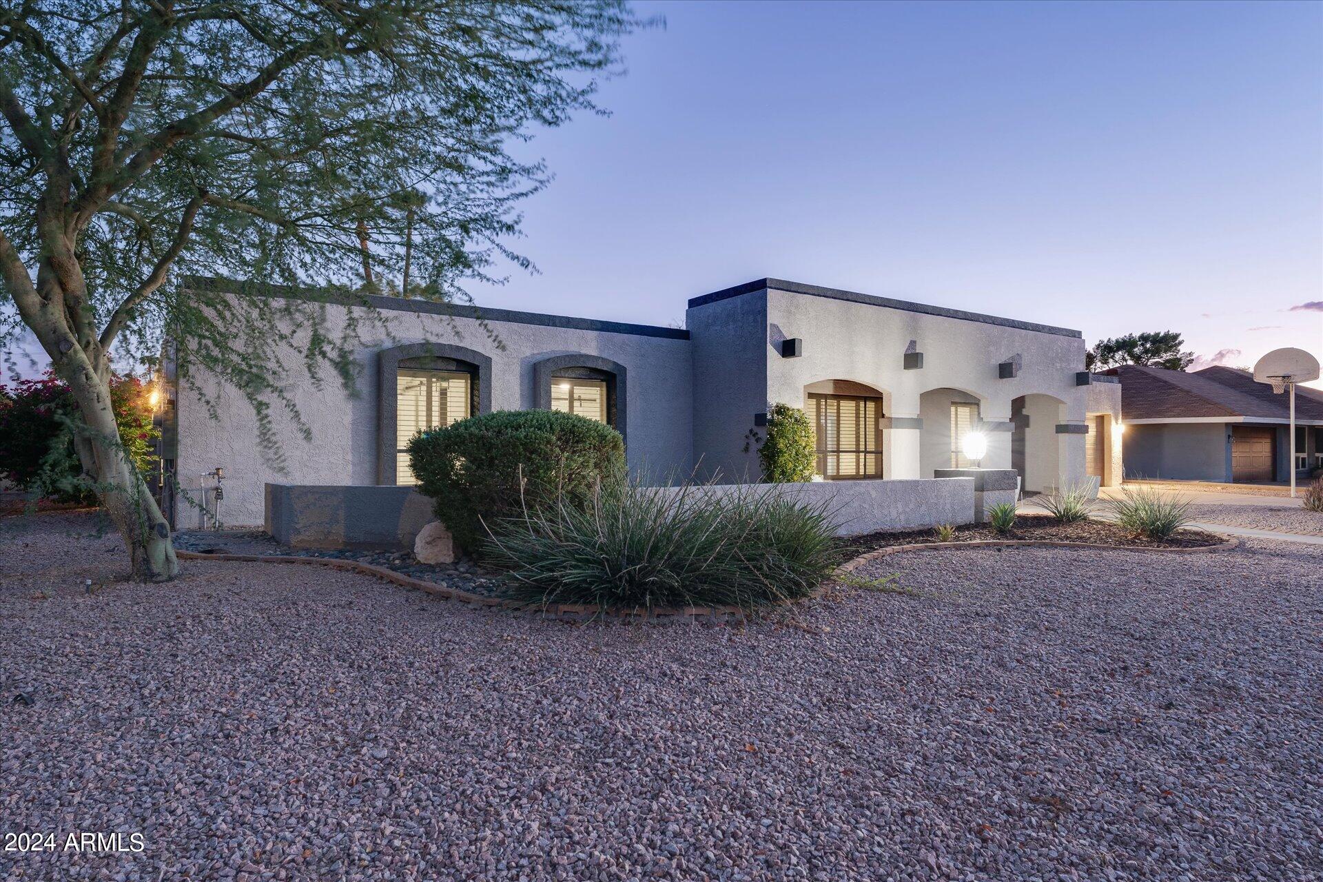 1893 East Bendix Drive Tempe, AZ 85283 - Photo 2 of 45 a front view of a house with garden