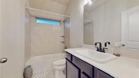 3308 Knoll Pines Road Denton, TX 76208 - Photo 12 of 13 a bathroom with a sink a toilet and shower