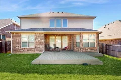 3308 Knoll Pines Road Denton, TX 76208 - Photo 8 of 13 a view of a house with a yard and sitting area