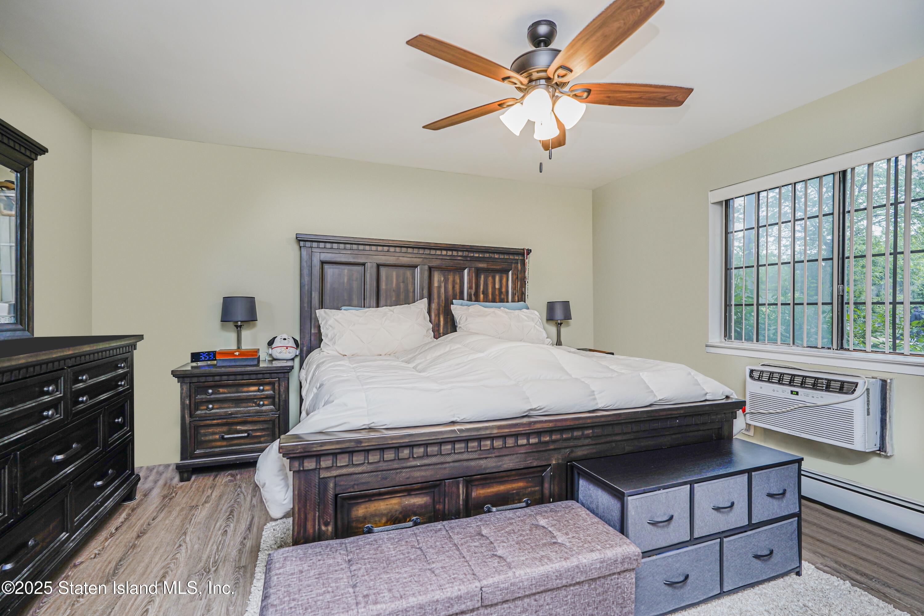 170 Devon Loop, Unit 3 Staten Island, NY 10314 - Photo 11 of 22 a bed room with a bed and a window