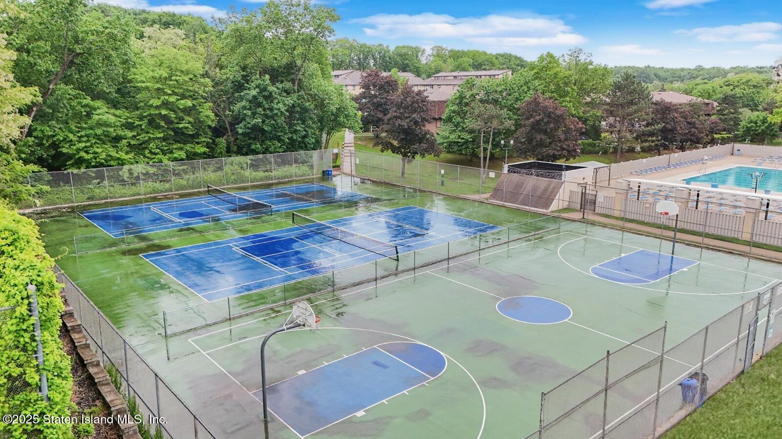 170 Devon Loop, Unit 3 Staten Island, NY 10314 - Photo 22 of 22 a view of a backyard with table and chairs
