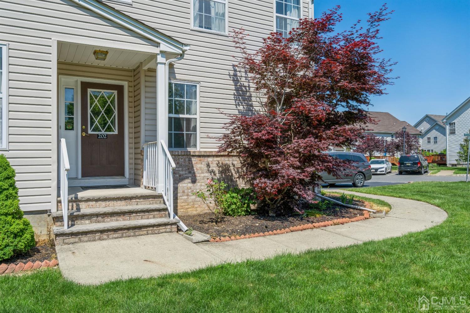 202 Hawthorne Road North Brunswick, NJ 08902 - Photo 2 of 21 a view of a house with a yard and a garden