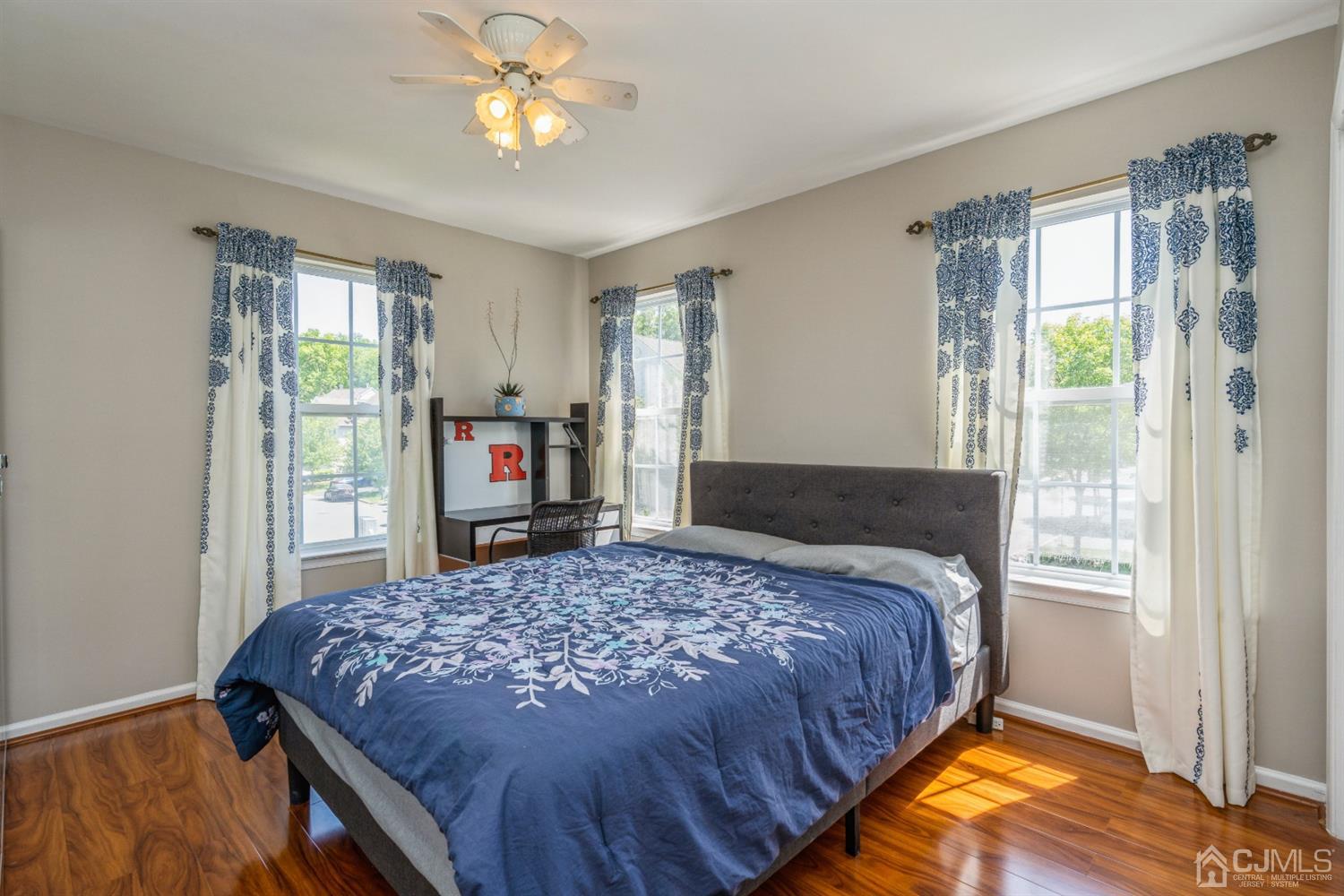 202 Hawthorne Road North Brunswick, NJ 08902 - Photo 13 of 21 a bedroom with a bed and a chandelier next to a window