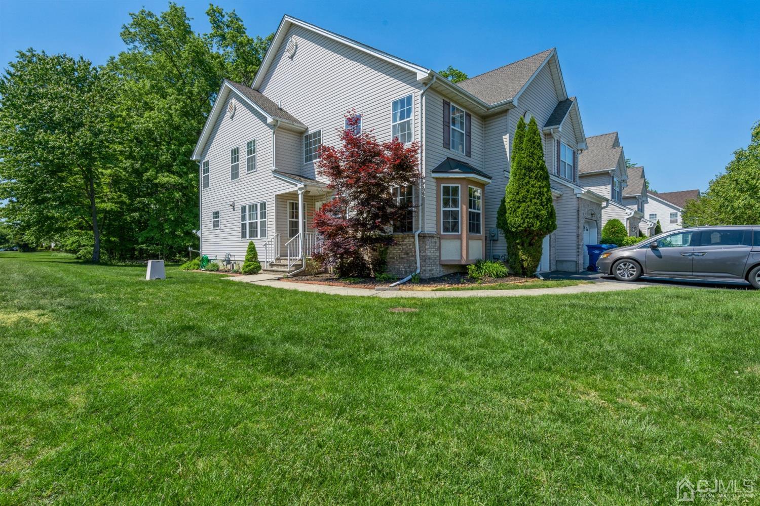 202 Hawthorne Road North Brunswick, NJ 08902 - Photo 19 of 21 a front view of house with yard and green space