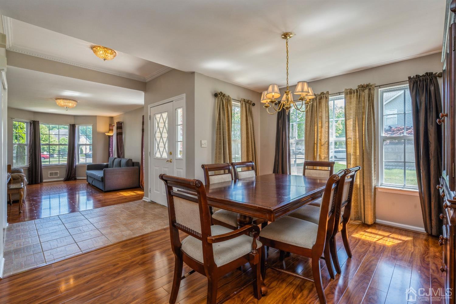 202 Hawthorne Road North Brunswick, NJ 08902 - Photo 3 of 21 a view of a dining room with furniture window and wooden floor