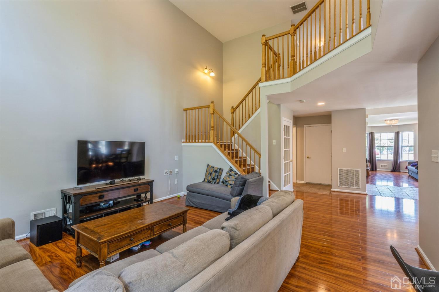 202 Hawthorne Road North Brunswick, NJ 08902 - Photo 7 of 21 a living room with furniture and a flat screen tv