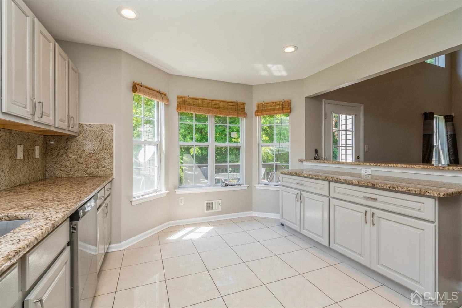 202 Hawthorne Road North Brunswick, NJ 08902 - Photo 9 of 21 a spacious bathroom with a granite countertop sink and a mirror