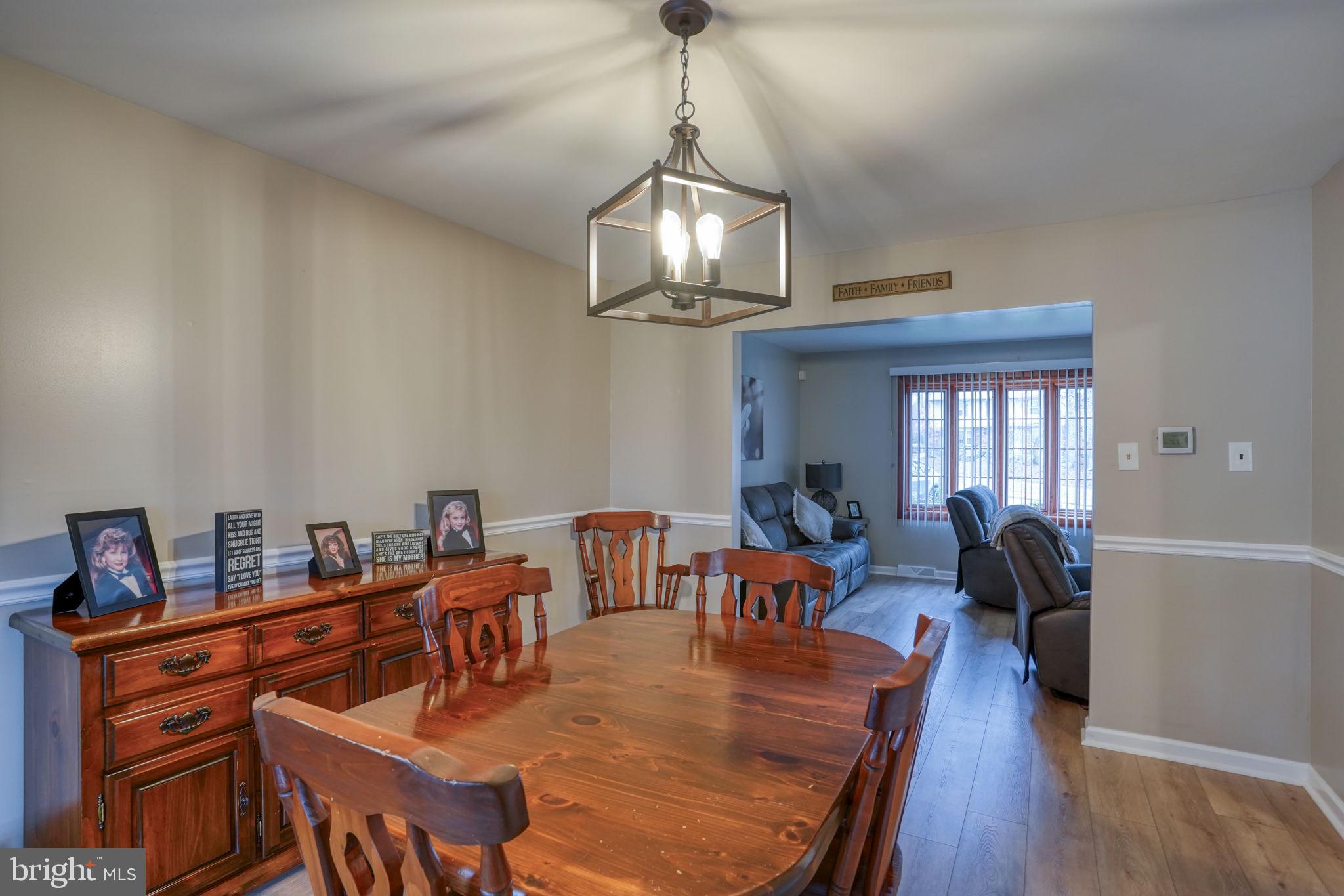 3850 Naamans Creek Road Upper Chichester, PA 19061 - Photo 11 of 53 a view of a dining room with furniture wooden floor and chandelier