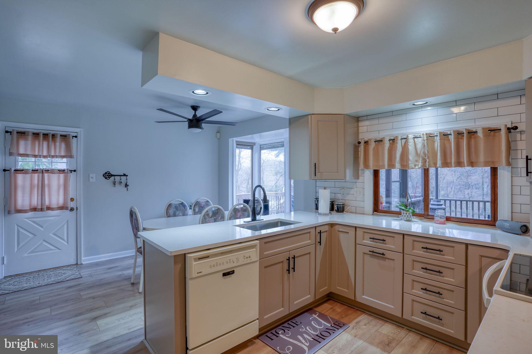 3850 Naamans Creek Road Upper Chichester, PA 19061 - Photo 15 of 53 a kitchen with a sink cabinets and appliances
