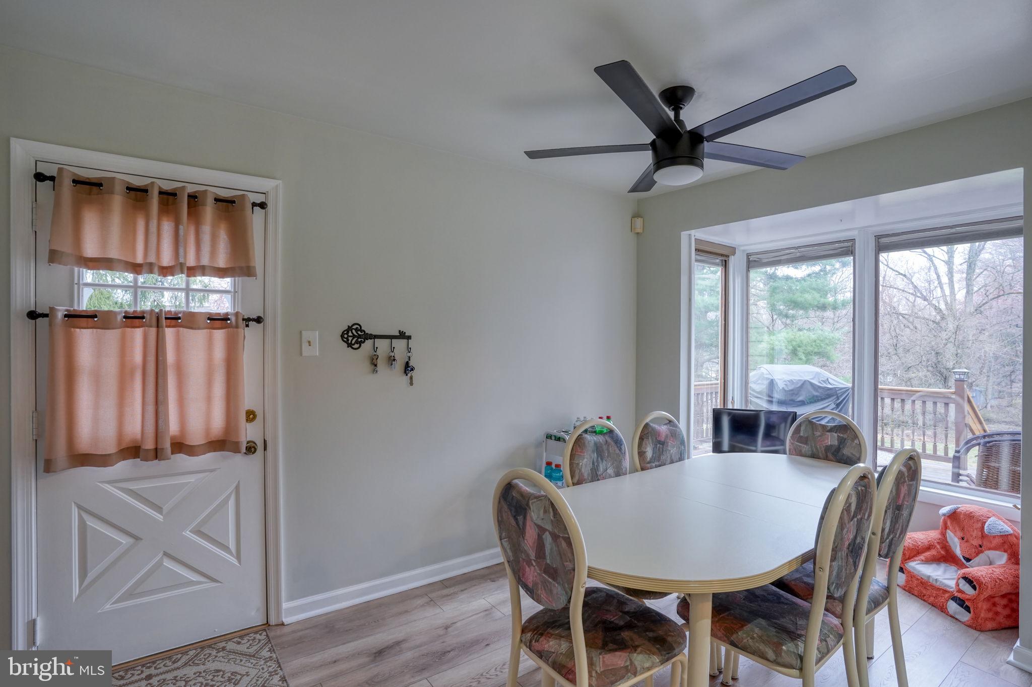 3850 Naamans Creek Road Upper Chichester, PA 19061 - Photo 18 of 53 a view of a dining room with furniture window and wooden floor