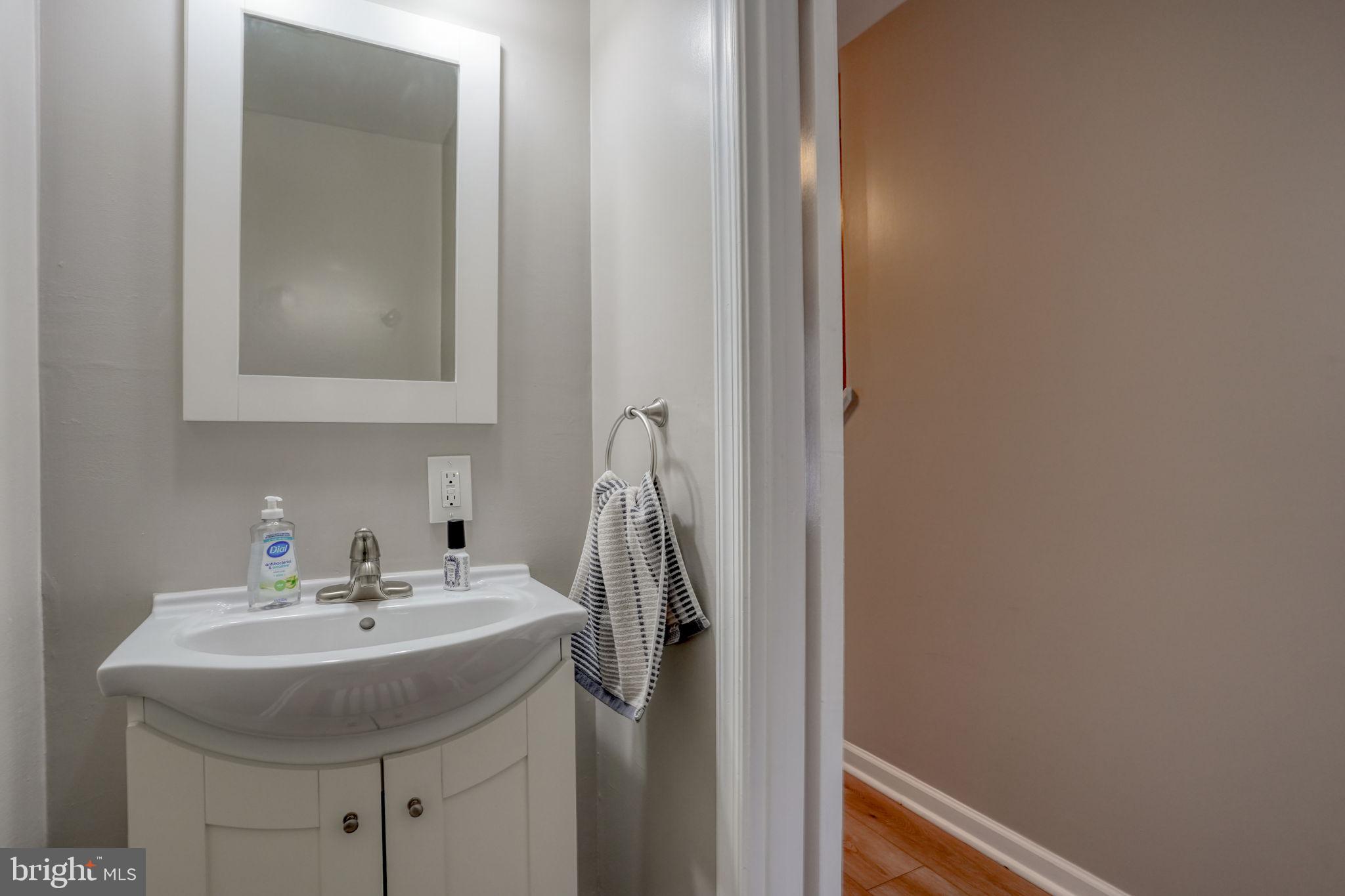 3850 Naamans Creek Road Upper Chichester, PA 19061 - Photo 19 of 53 a bathroom with a sink and a mirror