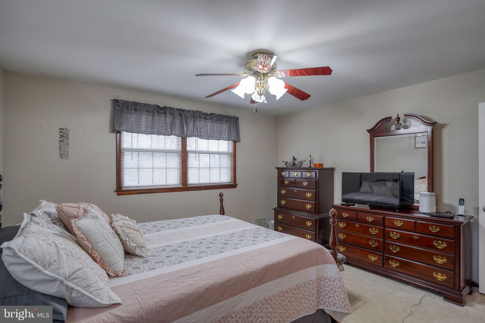 3850 Naamans Creek Road Upper Chichester, PA 19061 - Photo 25 of 53 a bedroom with a bed and a flat screen tv