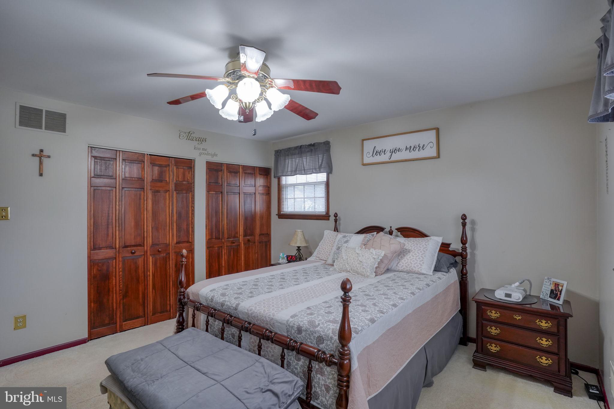 3850 Naamans Creek Road Upper Chichester, PA 19061 - Photo 26 of 53 a bedroom with a bed and a chandelier