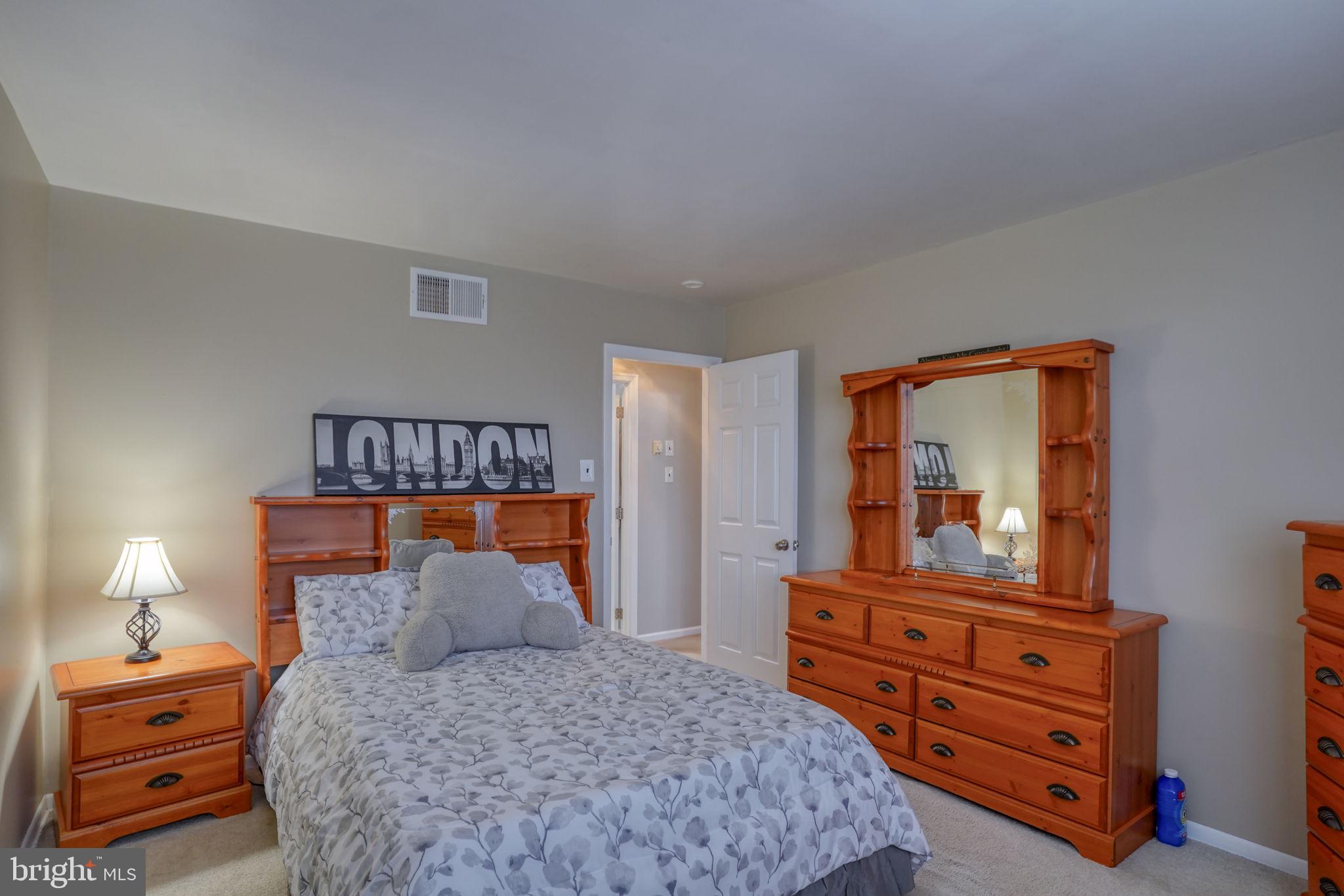 3850 Naamans Creek Road Upper Chichester, PA 19061 - Photo 27 of 53 a bedroom with a bed and a dresser in it