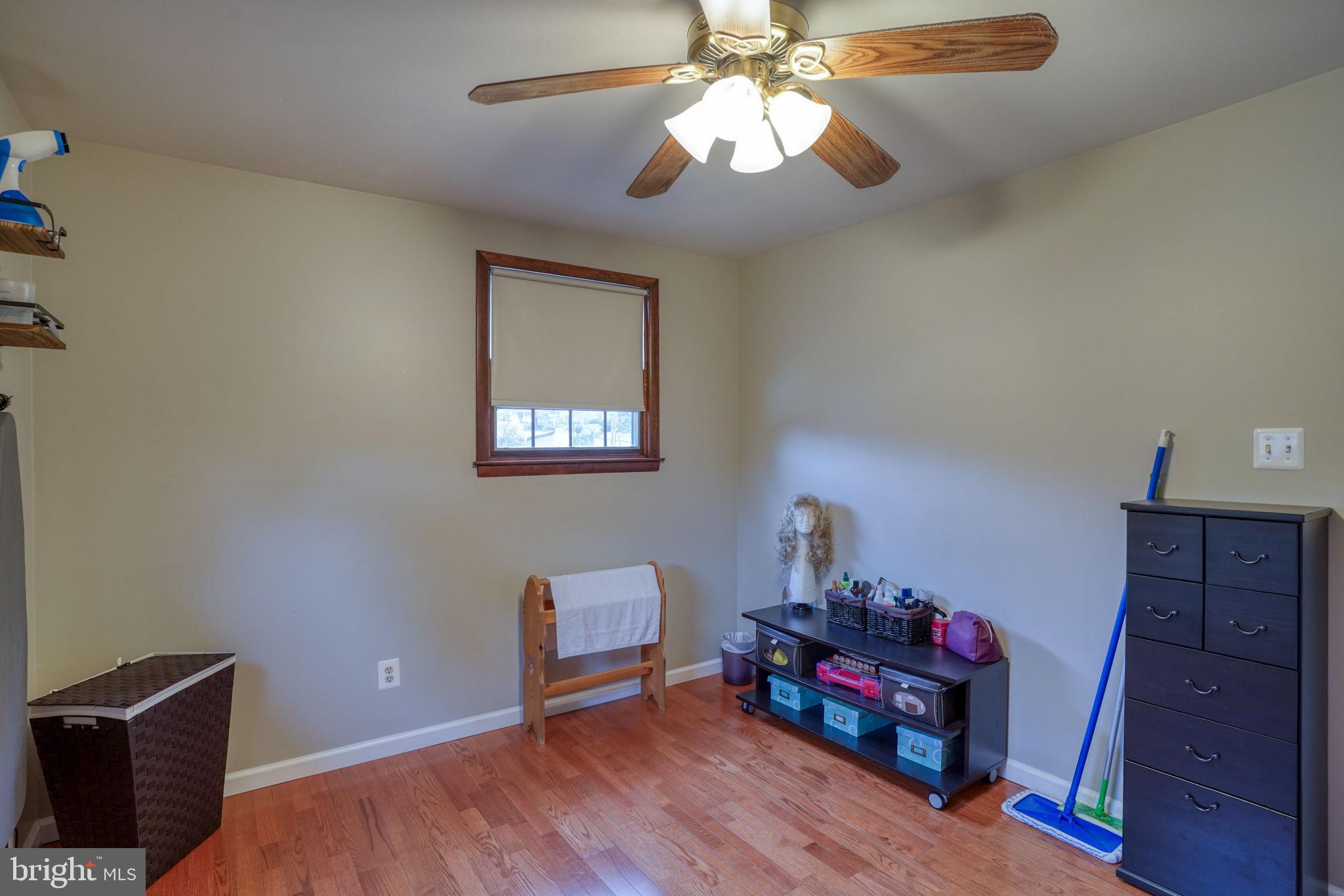 3850 Naamans Creek Road Upper Chichester, PA 19061 - Photo 34 of 53 a bedroom with furniture and a wooden floor