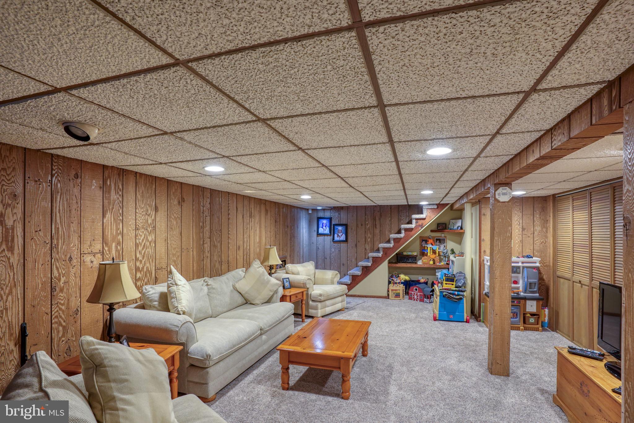 3850 Naamans Creek Road Upper Chichester, PA 19061 - Photo 40 of 53 a living room with furniture and a wooden floor