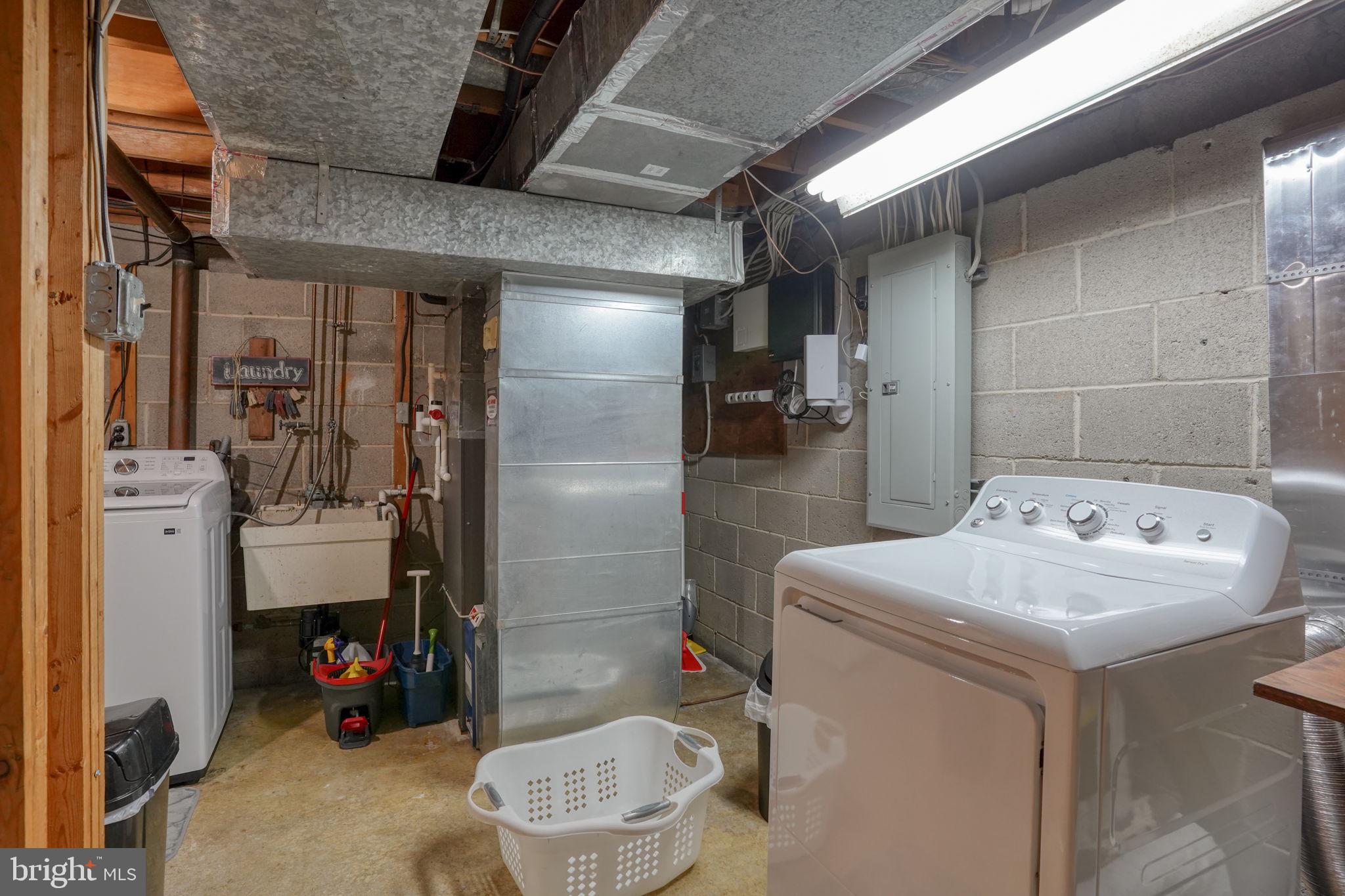 3850 Naamans Creek Road Upper Chichester, PA 19061 - Photo 41 of 53 a utility room with dryer and washer