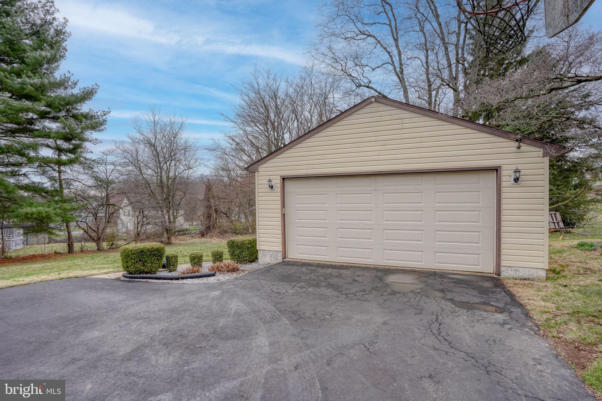 3850 Naamans Creek Road Upper Chichester, PA 19061 - Photo 45 of 53 a view of a house with a yard and garage