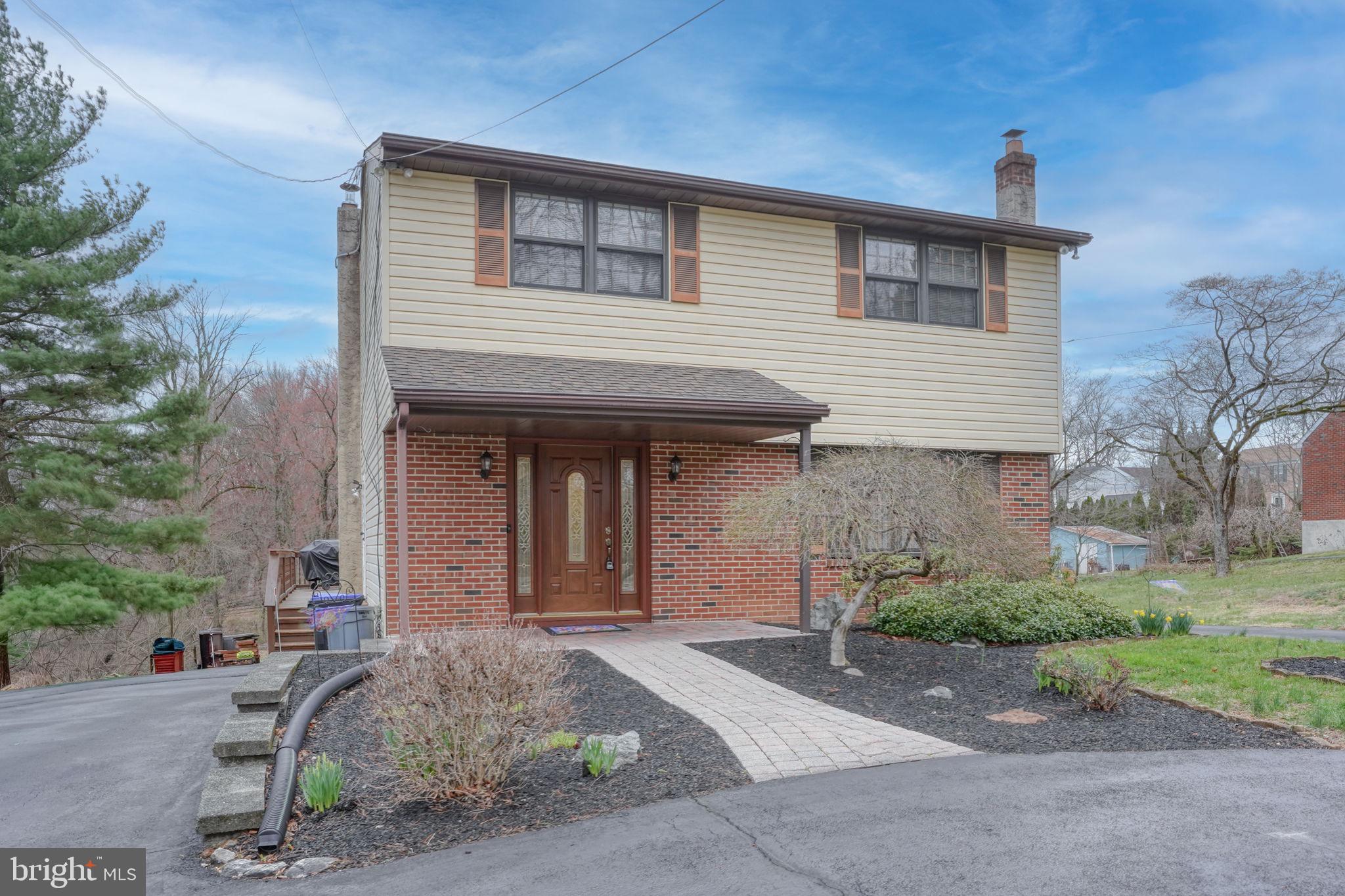 3850 Naamans Creek Road Upper Chichester, PA 19061 - Photo 50 of 53 a front view of a house with garden
