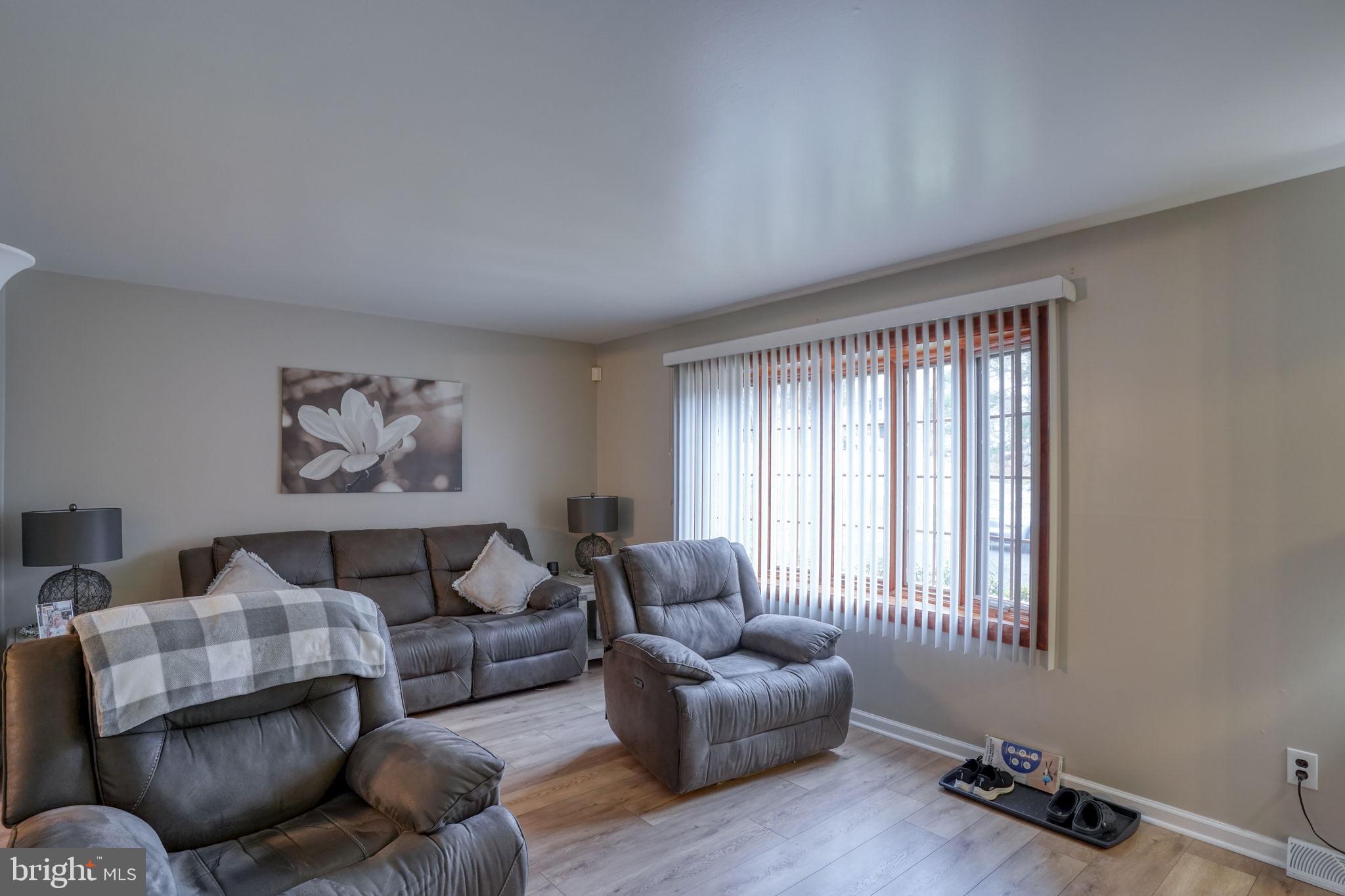 3850 Naamans Creek Road Upper Chichester, PA 19061 - Photo 5 of 53 a living room with furniture and a window