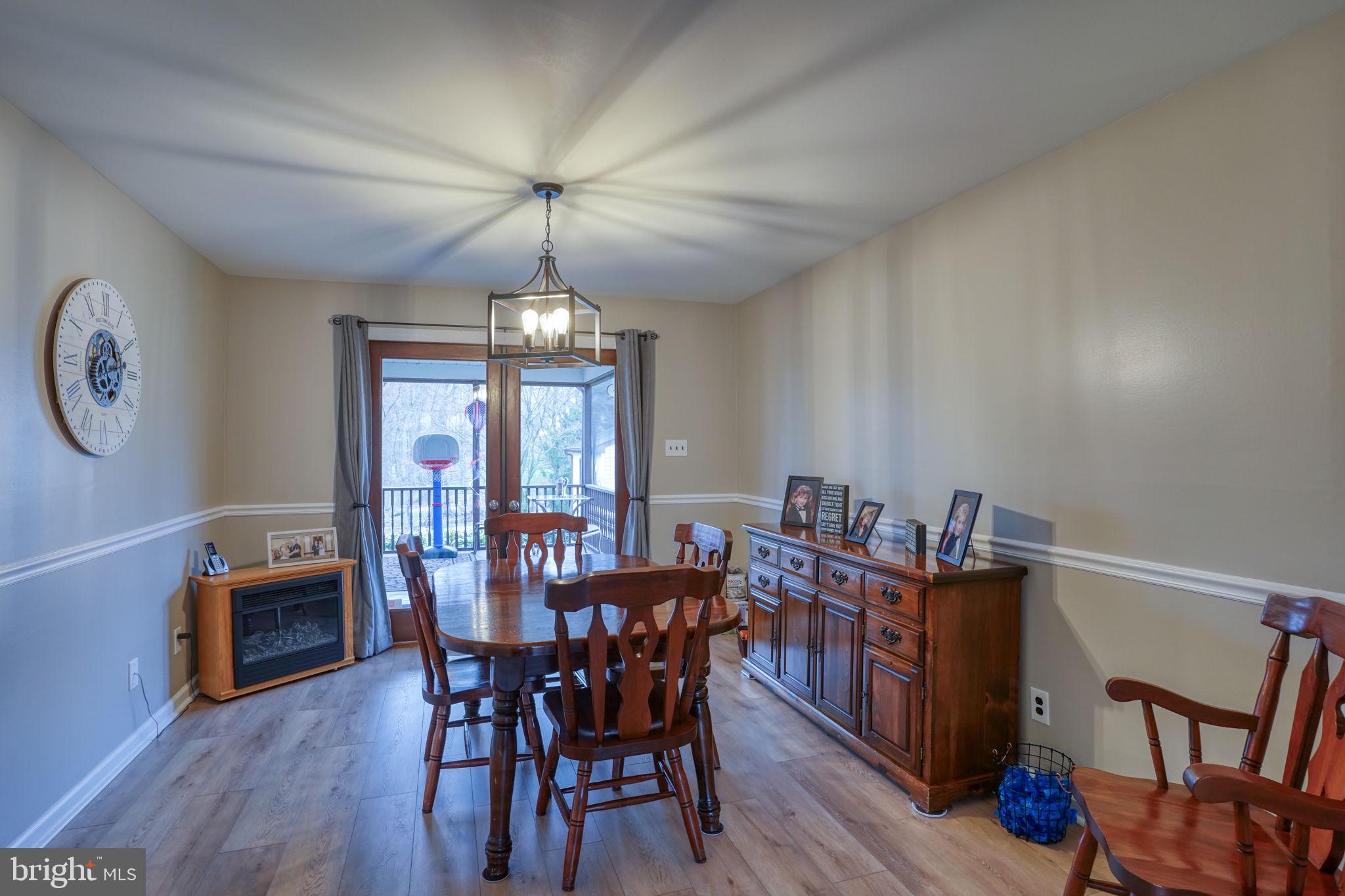 3850 Naamans Creek Road Upper Chichester, PA 19061 - Photo 10 of 53 a view of a dining room with furniture window and wooden floor
