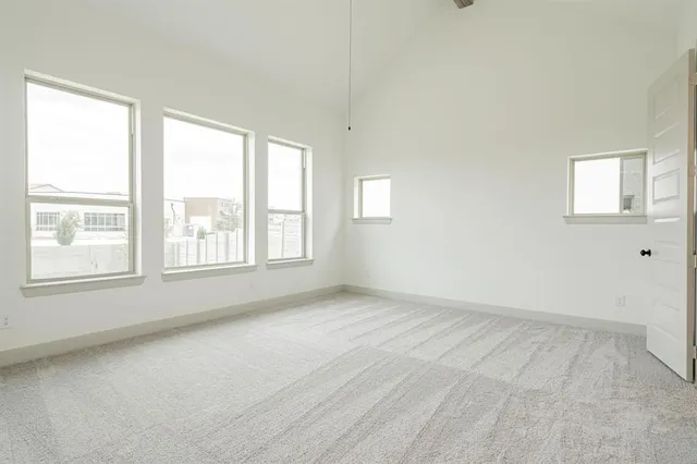 a kitchen with stainless steel appliances granite countertop a sink a stove and refrigerator