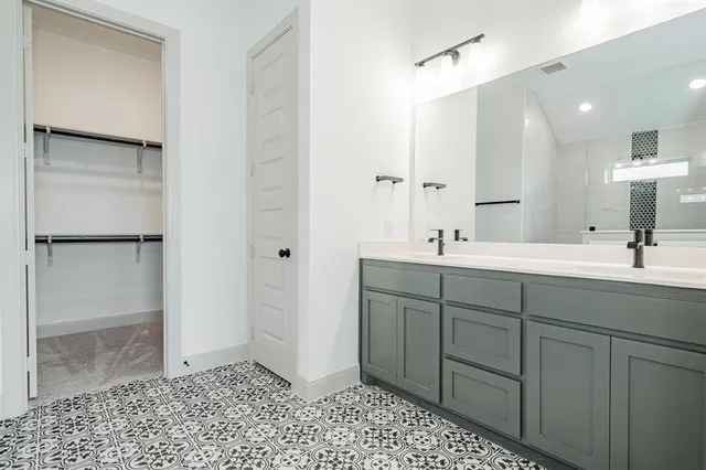 a bathroom with a sink a vanity and a mirror