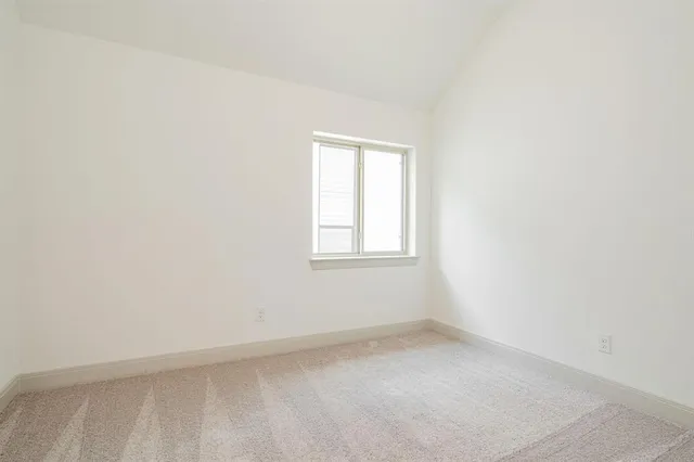 an empty room with closet area