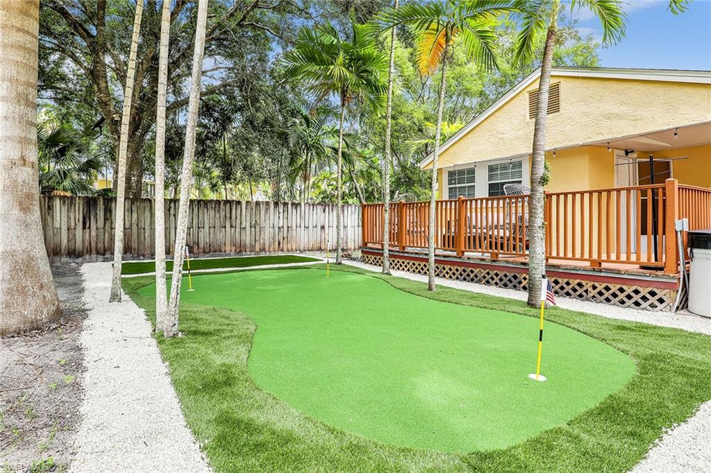 2780 Weeks Avenue Naples, FL 34112 - Photo 27 of 34 a view of a house with a backyard and a patio