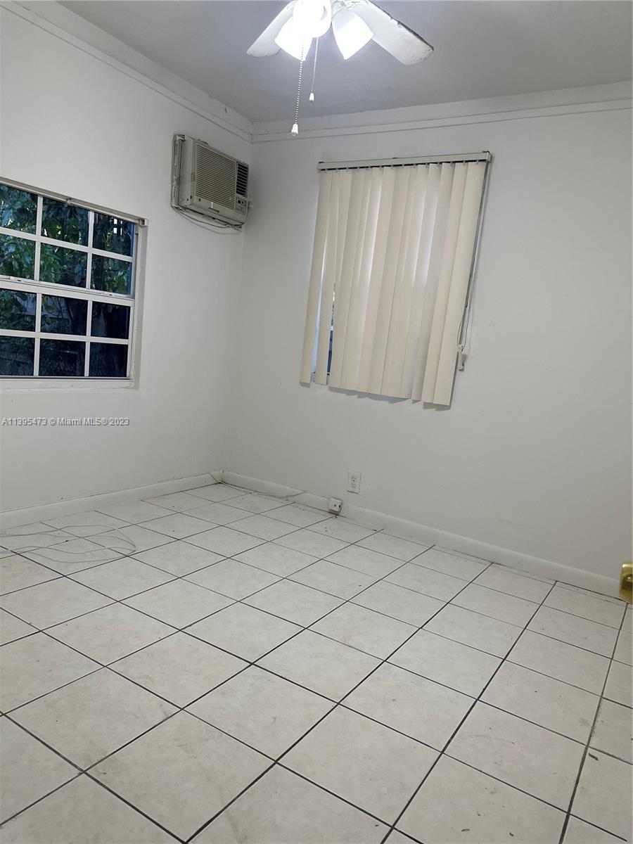276 East 12th Street Hialeah, FL 33010 - Photo 14 of 27 a view of an empty room with a window